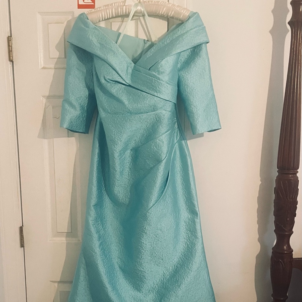 Beautiful turquoise evening gown! 
Never wore it, tags still on it!